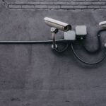 a logo resembeling surveillance cameras